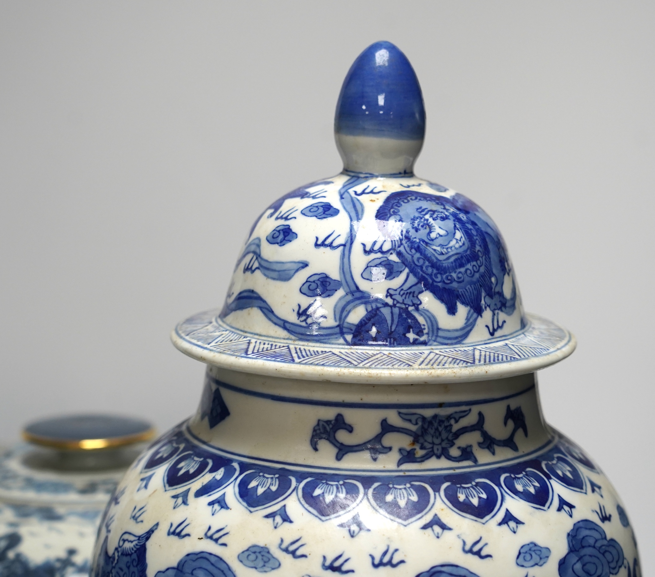 A 20th century Chinese blue and white vase and cover, a large bowl and cover and a smaller bowl and cover, tallest 44cm